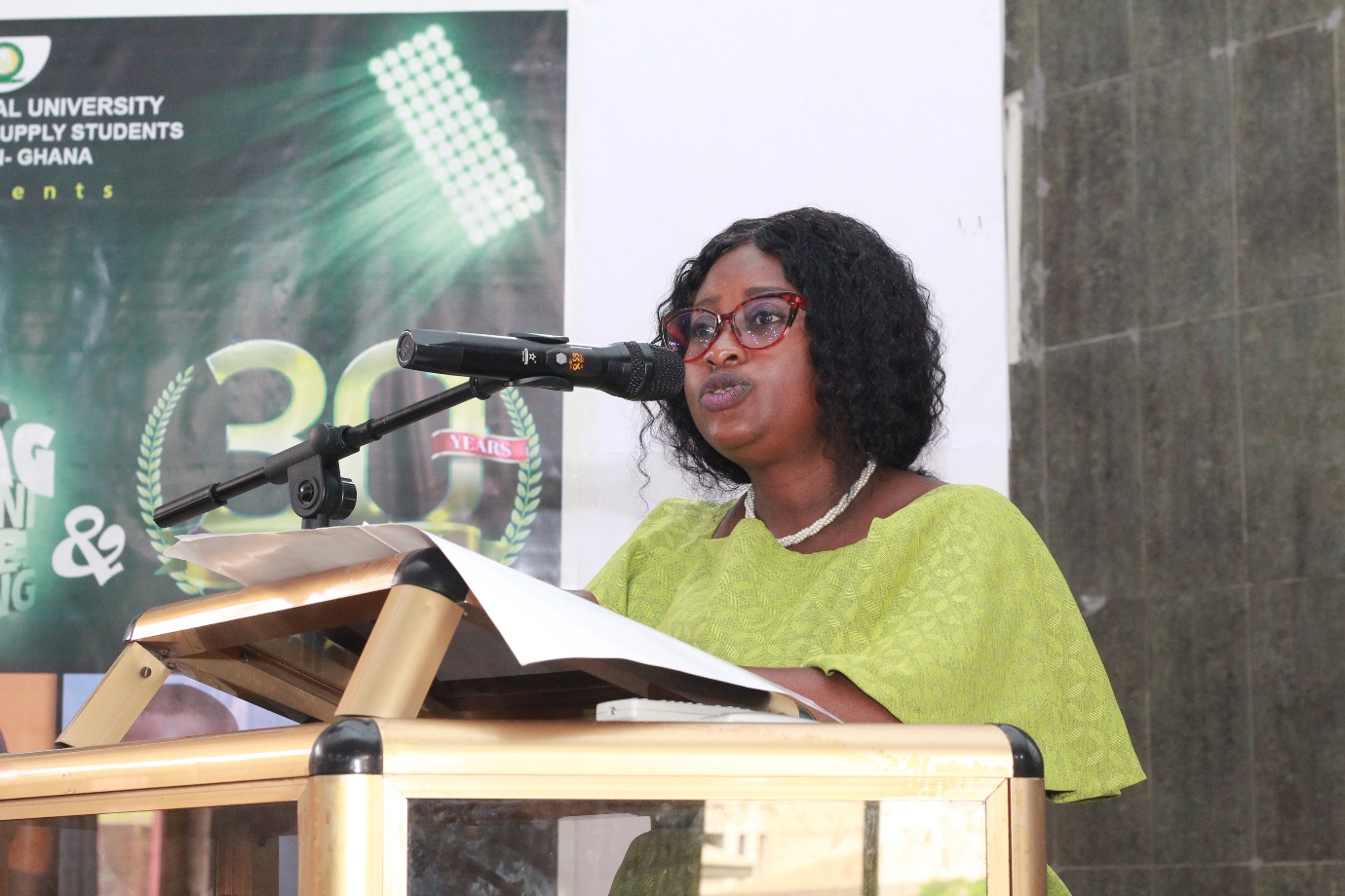 A person speaking at a podium