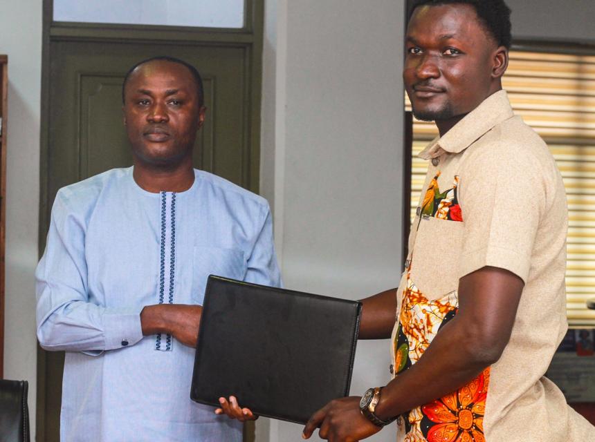 Prof. Gabriel Dwomoh (left) and Mr. Christopher Adu Gyamfi, CEO of Chafas present the signed Memorandum of Understanding (MoU) document in a group photo. 